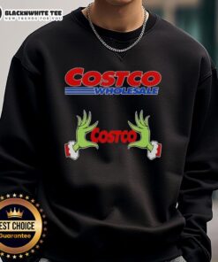 Alt Text: Awesome Grinch hands on a festive Christmas sweatshirt from Costco Wholesale, perfect for holiday cheer.