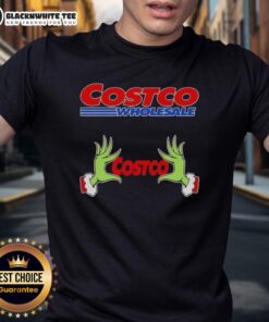 Awesome Grinch hands holding a red heart on a Costco Wholesale Christmas T-shirt design for festive holiday spirit.