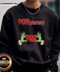 Alt Text: Awesome Grinch hands on a Christmas sweatshirt from CVS Pharmacy, perfect for holiday celebrations and festive style.