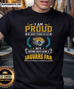 Jacksonville Jaguars fan wearing a t-shirt that says 'I Am Proud Of Many Things But Nothing Beats Being A Jaguars Fan'.