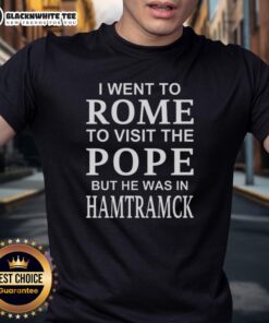 Alt Text: Awesome I Went To Rome To Visit The Pope But He Was In Hamtramck T-Shirt design featuring playful graphics and bold text.