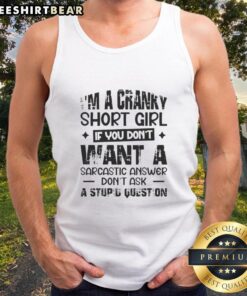 Cranky short girl wearing a sarcastic tank top that reads, 'Don't ask a stupid question,' showcasing her bold personality.