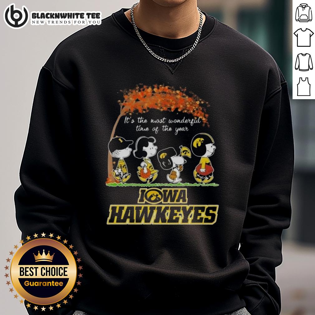 Awesome Iowa Hawkeyes X Peanuts Snoopy And Friends Autumn It's The Most Wonderful Time Of The Year Sweatshirt Alt Text: Awesome Iowa Hawkeyes X Peanuts Snoopy and Friends autumn sweatshirt for the most wonderful time of the year.
