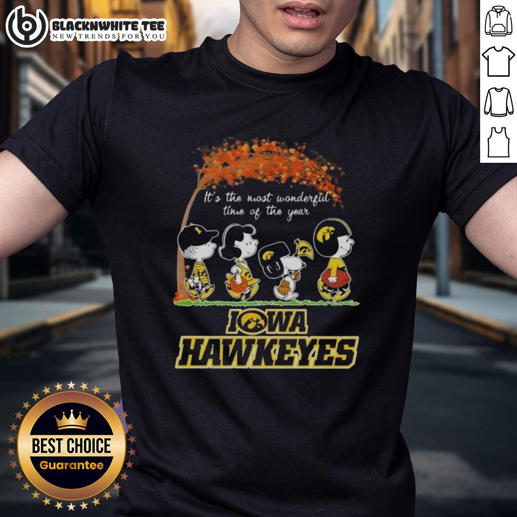 Awesome Iowa Hawkeyes X Peanuts Snoopy And Friends Autumn It's The Most Wonderful Time Of The Year T-Shirt Alt Text: Iowa Hawkeyes X Peanuts Snoopy and Friends autumn t-shirt celebrating the most wonderful time of the year.
