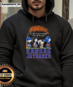 Alt Text: Awesome Kansas Jayhawks hoodie featuring Snoopy and friends in autumn, perfect for the most wonderful time of the year.