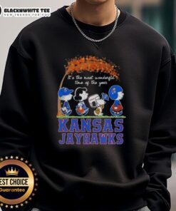 Cozy Kansas Jayhawks sweatshirt featuring Snoopy and friends, perfect for autumn and celebrating the season's joy.
