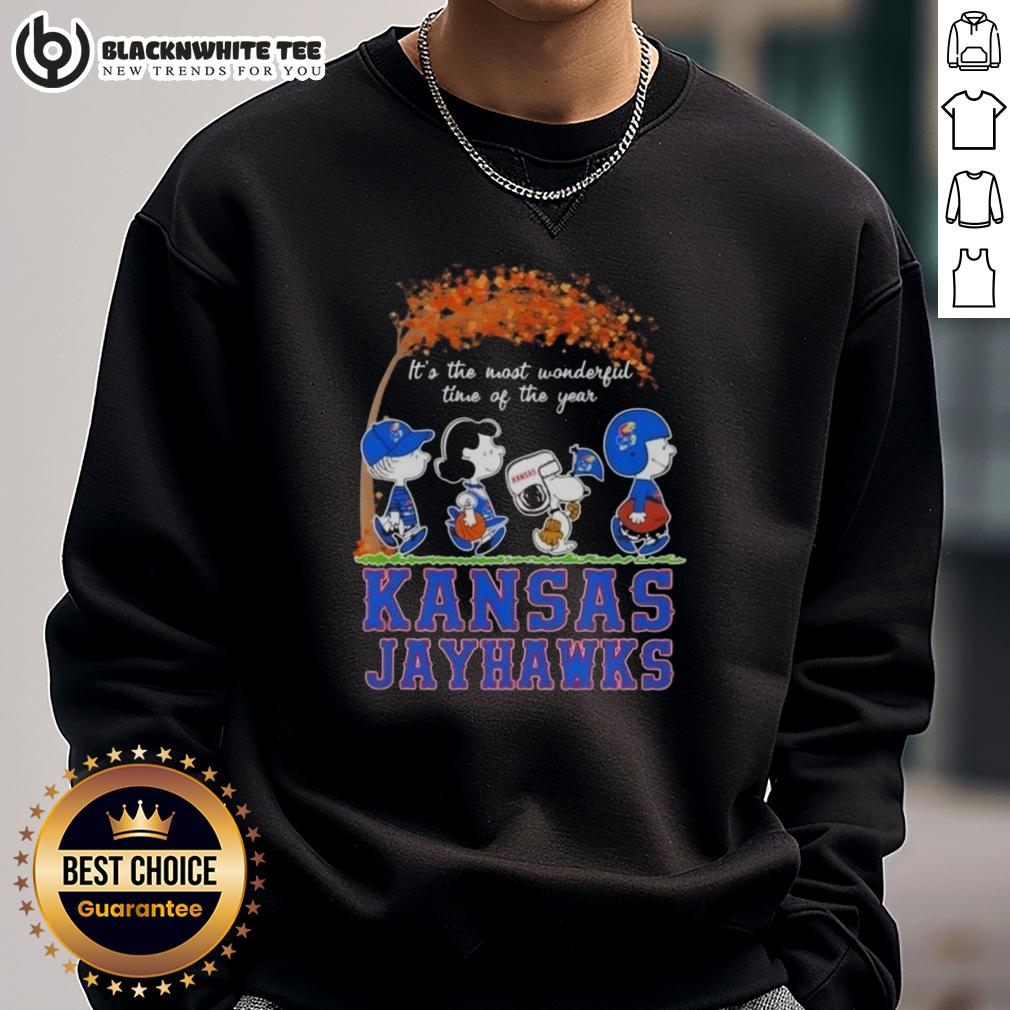 Awesome Kansas Jayhawks X Peanuts Snoopy And Friends Autumn It's The Most Wonderful Time Of The Year Sweatshirt Cozy Kansas Jayhawks sweatshirt featuring Snoopy and friends, perfect for autumn and celebrating the season's joy.