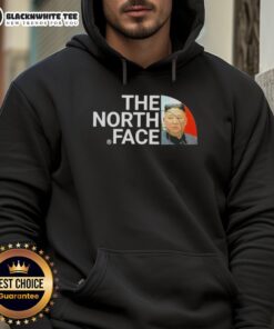 Alt Text: Kim Jong Un wearing an Awesome North Face hoodie, showcasing a unique blend of fashion and political persona.