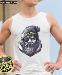 Alt Text: Awesome Las Vegas Raiders mascot wearing a beanie, sunglasses, and a tank top, ready for game day fun.