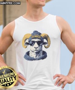 Alt Text: Los Angeles Rams mascot in a beanie and sunglasses, wearing a tank top, showcasing team spirit and fun.