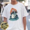 Alt Text: Awesome Miami Dolphins mascot in a beanie and sunglasses, showcasing team spirit on a trendy T-shirt.