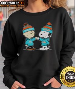 Awesome Miami Dolphins Snoopy and Charlie Brown best friends sweatshirt featuring vibrant graphics and cozy design.