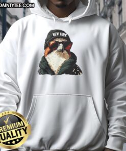 Alt Text: New York Jets mascot in a beanie and sunglasses hoodie, showcasing team spirit and style at a game.