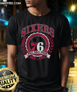 Alt Text: Retro Philadelphia 76ers NBA logo t-shirt with a laurel wreath frame, perfect for basketball fans and collectors.
