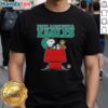 Alt Text: Awesome Philadelphia Eagles Snoopy chilling with football in Peanuts style on a fun t-shirt design for fans.