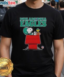 Alt Text: Awesome Philadelphia Eagles Snoopy chilling with football in Peanuts style on a fun t-shirt design for fans.