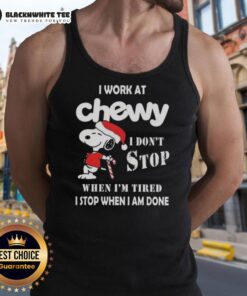 Alt Text: Awesome Snoopy tank top with Christmas theme, featuring 'I work at Chewy, I dont stop when Im tired' slogan.