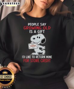 Alt Text: Snoopy sweatshirt featuring the phrase 'Growing old is a gift, I'd like to return mine for store credit.'