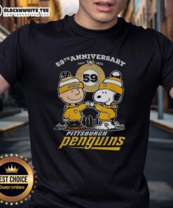 Awesome Snoopy touching hands with Charlie Brown on Pittsburgh Penguins 59th Anniversary 1967-2026 T-Shirt design.