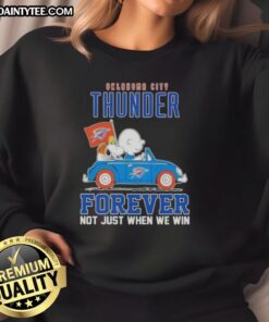 Awesome Snoopy and Charlie Brown driving a car in Oklahoma City Thunder sweatshirt, celebrating fandom and sports spirit.