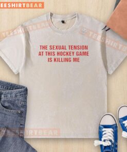 Awesome washed t-shirt featuring 'The Sexual Tension In This Hockey Game Is Killing Me' graphic design.