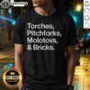 Awesome Torches Pitchforks Molotovs And Bricks 2025 World Tour T-Shirt featuring bold graphics and vibrant colors.