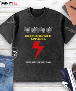 Alt Text: Awesome Unauthorized Apparel The Art of Guitar washed t-shirt featuring a vintage guitar graphic on soft fabric.