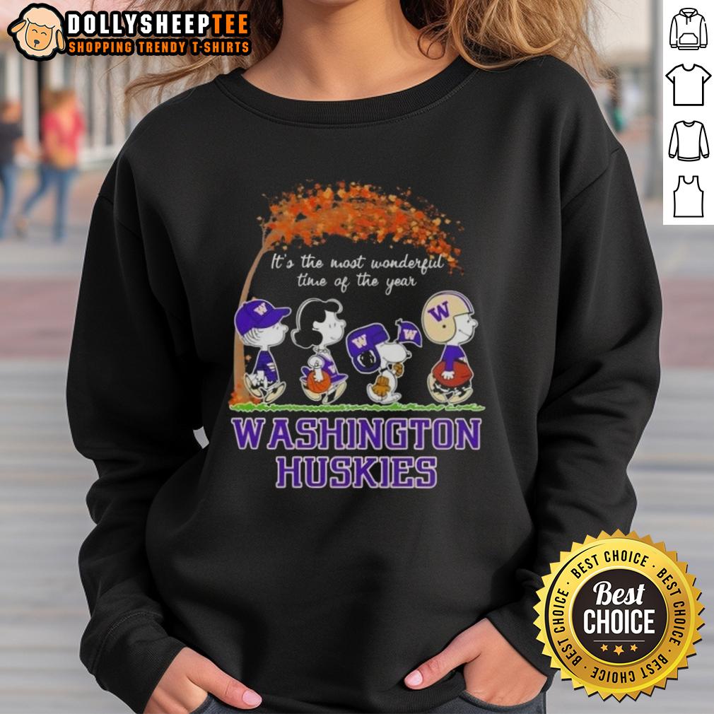 Awesome Washington Huskies X Peanuts Snoopy And Friends Autumn It's The Most Wonderful Time Of The Year Sweatshirt Alt Text: Awesome Washington Huskies X Peanuts Snoopy sweatshirt for autumn, featuring Snoopy and friends in a festive design.