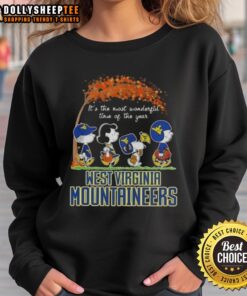 Awesome West Virginia Mountaineers sweatshirt featuring Snoopy and friends in autumn, perfect for fall sports fans.