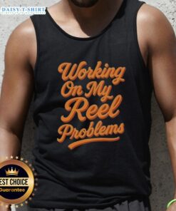Alt Text: Person wearing an 'Awesome Working On My Reel Problems' fishing tank top, showcasing a fun fishing-themed design.