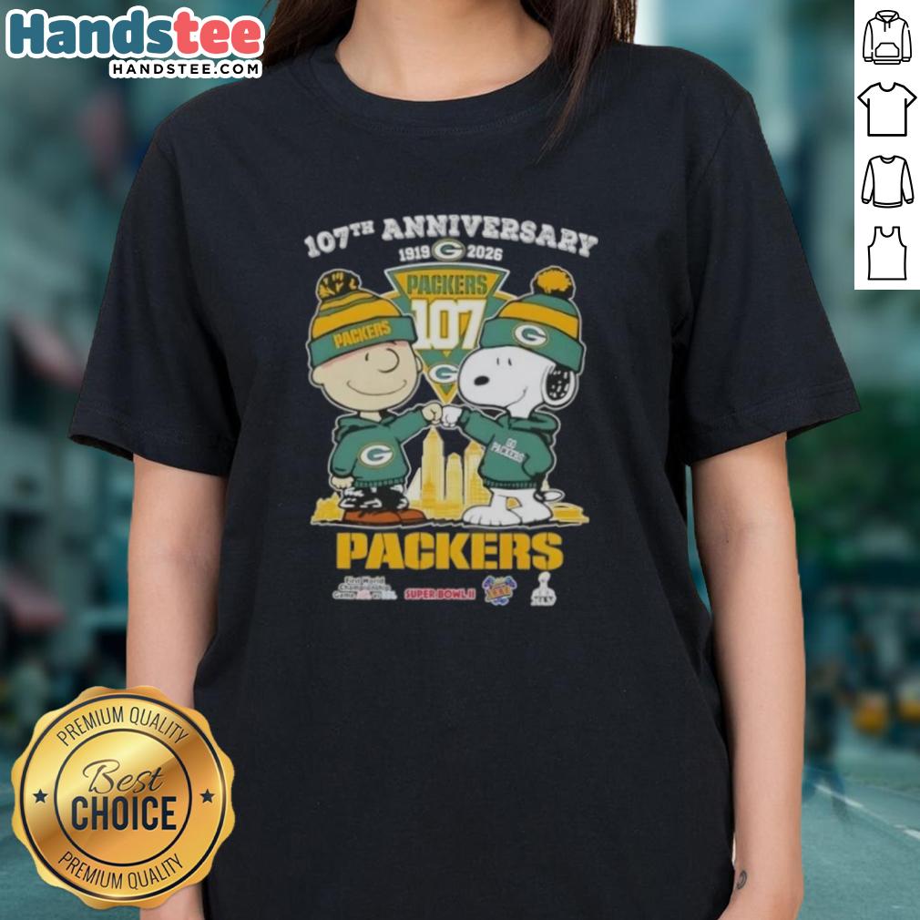 cute-charlie-brown-and-snoopy-107th-anniversary-1919-2026-green-bay-packers-football-skyline-ladies-tee Alt Text: Cute Charlie Brown and Snoopy 107th Anniversary Ladies Tee featuring Green Bay Packers football skyline design.