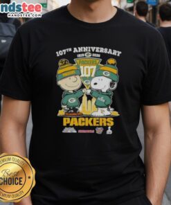 Alt Text: Cute Charlie Brown and Snoopy 107th Anniversary T-Shirt featuring Green Bay Packers football skyline design.