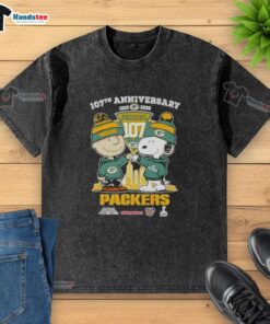 Alt Text: Cute Charlie Brown and Snoopy 107th Anniversary T-Shirt featuring Green Bay Packers football skyline design.
