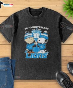 Alt Text: Cute Charlie Brown and Snoopy 96th Anniversary t-shirt featuring Detroit Lions skyline, perfect for fans.