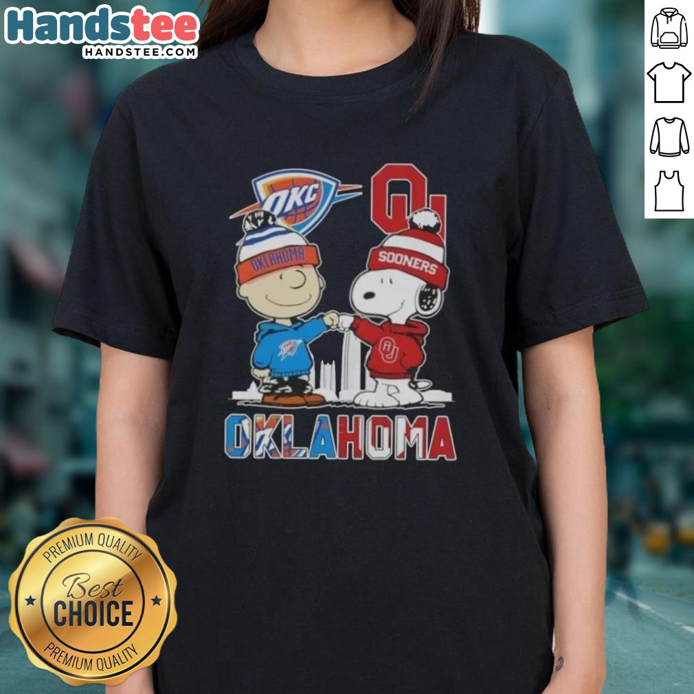 cute-charlie-brown-and-snoopy-oklahoma-city-sports-thunder-x-sooners-skyline-ladies-tee Alt Text: Cute Charlie Brown and Snoopy graphic on Oklahoma City Sports Thunder x Sooners ladies tee shirt.