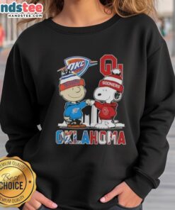 Alt Text: Cute Charlie Brown and Snoopy on Oklahoma City Thunder and Sooners skyline sweatshirt, perfect for sports fans.