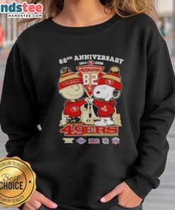 Alt Text: Cute Charlie Brown and Snoopy on a sweatshirt celebrating the 82nd Super Bowl, featuring 49ers skyline design.