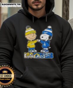 Alt Text: Cute Charlie Brown fist bump with Snoopy in Los Angeles sports Rams x Dodgers hoodie, perfect for fans.