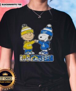 Cute Charlie Brown fist bump with Snoopy, featuring Los Angeles Rams and Dodgers logo on ladies tee shirt.