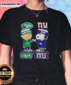 Alt Text: Cute Charlie Brown fist bump with Snoopy in NYC, featuring Jets x Giants ladies tee design for sports fans.