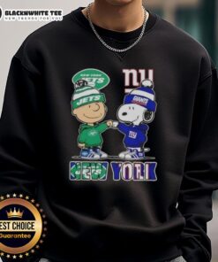 Alt Text: Cute Charlie Brown fist bump with Snoopy in NYC sports Jets and Giants sweatshirt, perfect for fans.