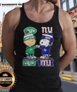 Alt Text: Cute Charlie Brown and Snoopy fist bump in New York City, showcasing Jets and Giants theme on a stylish tank top.