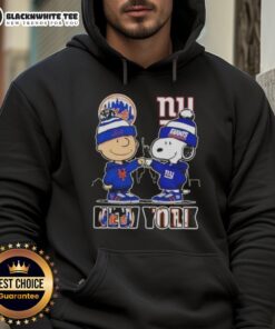 Alt Text: Cute Charlie Brown fist bump with Snoopy in a New York City skyline hoodie featuring Mets and Giants sports themes.