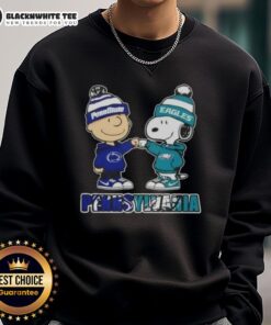 Cute Charlie Brown fist bump with Snoopy on a sweatshirt featuring Nittany Lions and Philadelphia Eagles design.