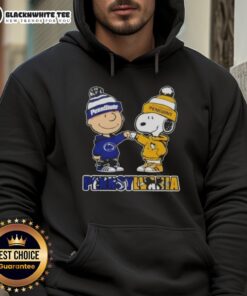 Cute Charlie Brown fist bump with Snoopy in Nittany Lions hoodie, featuring Pittsburgh Penguins logo in Pennsylvania.