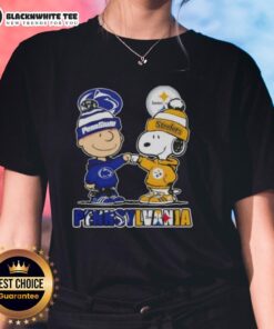 Cute Charlie Brown fist bumping Snoopy with Pennsylvania skyline, featuring Nittany Lions and Steelers themes on a ladies tee.