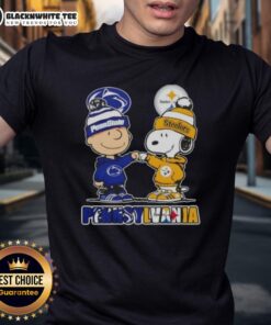 Cute Charlie Brown fist bump with Snoopy, featuring Pennsylvania skyline, Nittany Lions & Steelers on a stylish T-shirt.