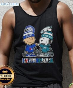 Alt Text: Cute Charlie Brown fist bump with Snoopy, Philadelphia skyline tank top featuring 76ers and Eagles logos.
