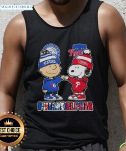 Cute Charlie Brown fist bump with Snoopy on a Philadelphia City Sports 76ers X Phillies tank top design.