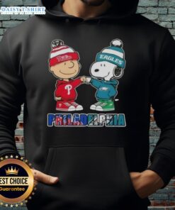 Cute Charlie Brown fist bump with Snoopy in a Philadelphia sports hoodie featuring Phillies and Eagles logos.